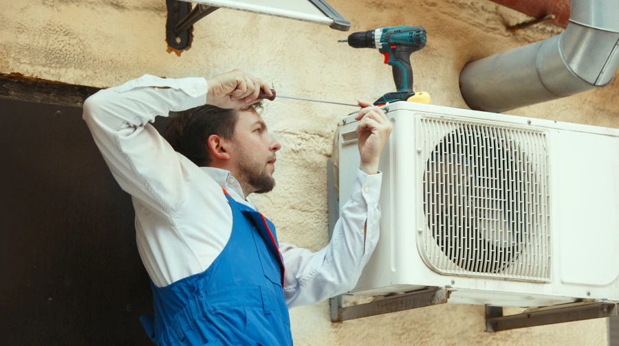 technician installing hvac unit